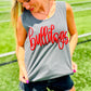 Woman wearing a gray tank top with 'Bulldogs' in red text on a grassy field.