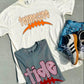 Two t-shirts with 'Tennessee' and 'tide' graphics on a gray surface with sneakers.