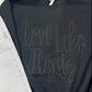 Black puff and glitter vinyl graphic tee with the text 'LOVE LIKE JESUS' printed on the front.