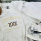 White sweatshirt with 'Cottontail Candy Co. est.