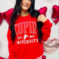 Woman wearing a red 'Cupid University' sweatshirt with heart-shaped decorations in the background.