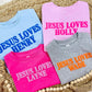 Four children's sweatshirts with Jesus Loves personalized names on a woven mat.