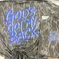 Mossy Oak Bottomland t-shirt with blue text 'God's Got My Back' on a white background