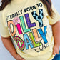 Person wearing a yellow t-shirt with colorful Born to Dilly Dally text design on a plain background