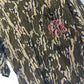 Camouflage dress with pink monogram on a hanger