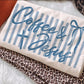 Fabric with 'Coffee & Jesus' text on a leopard print background