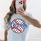 Person wearing a white t-shirt with 'Devils' and a baseball design, taking a mirror selfie.