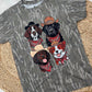 Gray t-shirt with illustrations of dogs wearing hats and bandanas on a textured surface.