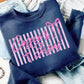 Navy sweatshirt with 'Coffee & Jesus' text in pink on a textured surface