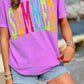 Person wearing a purple t-shirt with 'SUMMER' in colorful letters, standing outdoors.