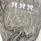 Mossy Oak Camouflage shirt with 'Dash Forward Boutique' text and pink bows on a white surface