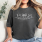 Person wearing a dark gray t-shirt with a "Color Guard is my favorite season" graphic design and text, sitting on a couch.