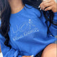 Person wearing a blue sweatshirt with 'Blue Devils' text and logo.