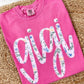 Crunchberry Comfort Color tee sweatshirt with floral 'gigi' graphic dtf text on a textured surface