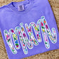Violet Purple Comfort Color tee sweatshirt with floral pring 'MiMi' dtf graphic text on a textured surface