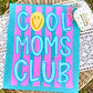 Canvas with 'Cool Moms Club' text on a striped background, placed on a woven surface.